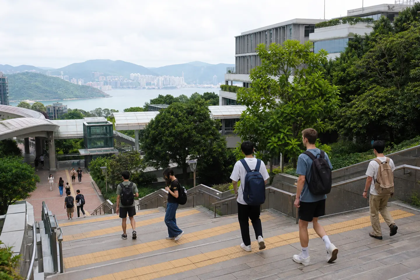Hong Kong campuses are steep, green, and full of covered walkways. You will get your steps in.